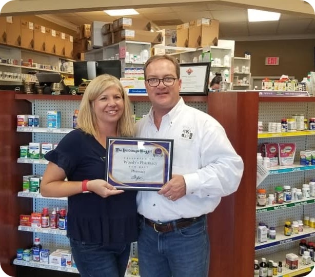 Woody's Pharmacy owners inside the pharmacy