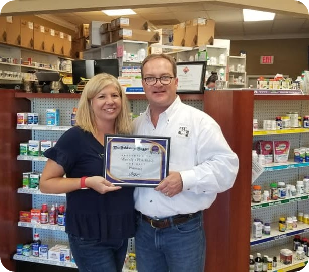 Woody's Pharmacy owners inside the pharmacy